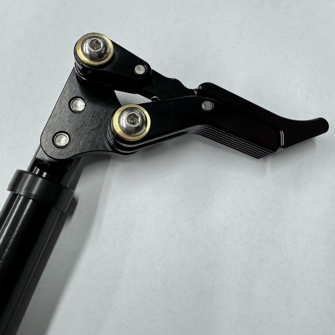 Adjustable wheelchair scissor brakes